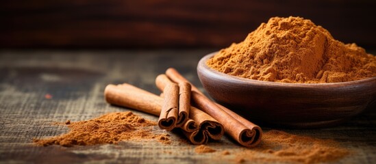 Poster - Ceylon cinnamon sticks and powder on a textured wooden surface, perfect for baking, desserts, and drinks, with a fragrant aroma. Close-up with copy space image.