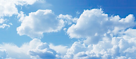 Fototapete - Close-up of a textured blue sky with soft clouds, ideal as a background image with copy space.