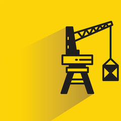 Wall Mural - port crane icon with shadow on yellow background