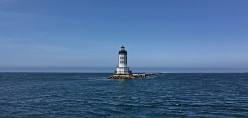 Wall Mural - Panoramic view of a calm Pacific near a lighthouse