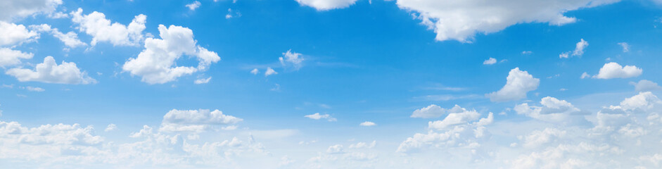 Wall Mural - clear blue sky with a few clouds. The sky is very bright and the clouds are scattered throughout