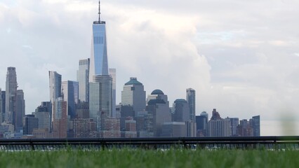 Wall Mural - New York City waterfront skyline, Manhattan Downtown World Trade Center building riverfront skyscraper. Waterside cityscape from Pier A Park, New Jersey Hoboken. United States architecture, grass lawn