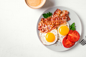 Wall Mural - Breakfast with fried eggs and bacon and coffee