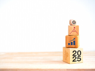 Poster - 2025 Happy New year background banner. Numbers, growth graph, leader and target icon on the top of small to big wooden cube blocks stacked on wood table and white background with copy space, minimal.
