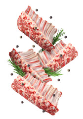 Wall Mural - Raw ribs, rosemary and peppercorns in air isolated on white