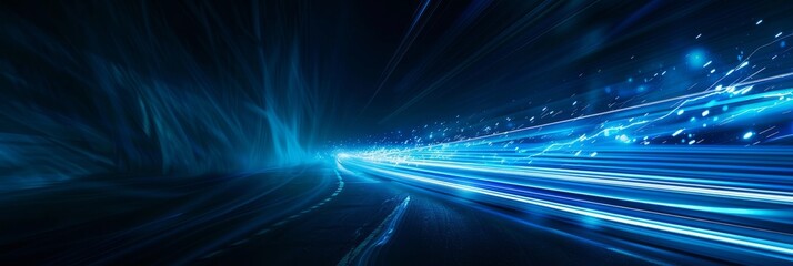 Poster - a high-angle photograph of blue light streaks racing across a dark background, creating a futuristic