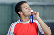 © auremar - man in running gear kissing medal