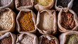 © Synaptic Studio - Assorted whole grains and seeds in paper bags. Whole Grains Month, health and nutrition concept.