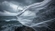 © Justlight - On a stormy day the wild winds whip the fabric into a frenzy creating a dramatic display against the moody seaside cliff.