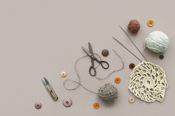 Sticker - Knitting needles, yarn balls and buttons on grey background