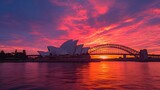 1. Capture a breathtaking sunrise over Sydney Harbour, with the iconic Sydney Opera House and Sydney Harbour Bridge silhouetted against a backdrop of vivid orange and pink hues, showcasing the city's