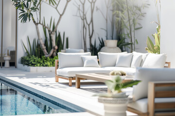 Canvas Print - Outdoor pool area with modern furniture, surrounded by garden with plants and trees