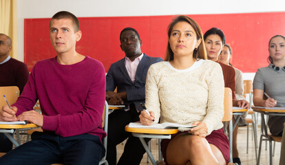 Sticker - Portrait of beautiful Latin American girl student on background multiethnic group of people