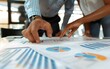 © AhmadTriwahyuutomo - Businesspeople Analyzing Charts and Graphs