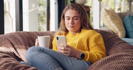 Poster - Girl, smartphone and relax with coffee in home in morning for social media, trending news and scroll internet for post. Woman, bean bag and online for comfort or rest, peace and text communication.