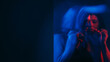 © golubovy - Schizophrenia suffering. Blur woman. Troubled female mental disorder stress neon red blue silhouette out of focus double exposure empty space.