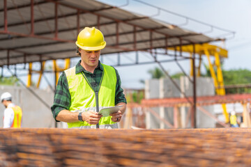 Wall Mural - Engineer and foreman worker team inspect the construction site, Site manager and builder on construction site.