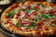 © Nico - A gourmet pizza topped with prosciutto, arugula, shaved Parmesan, and truffle oil.