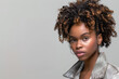 © Владимир Солдатов - A young African American woman with beautiful curly hair, looking confidently into the camera