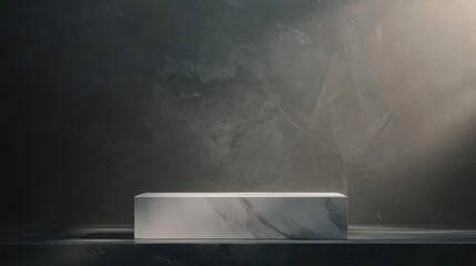 Elegant marble pedestal on a dark background illuminated by a soft spotlight, perfect for product display and presentations.