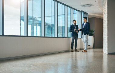 Poster - Office, consulting and men in lobby together talking, planning and networking for collaboration. Discussion, partnership and business people at window with advice, team support and project management