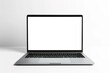 © Larisa - Mockup silver laptop with blank screen on white background with space for text.