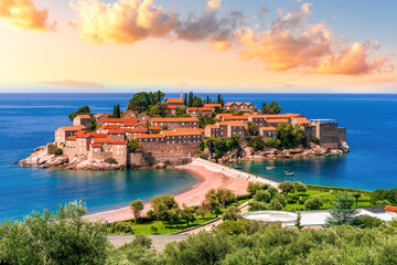 beautiful summer landscape of amazing resort on amazing island with yellow ancient walls and orange tile roofs among sea vawes and nice blue sky on background