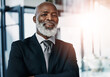 © Reese Coop/peopleimages.com - CEO, portrait and mature black man in office for corporate career, business or leadership in Kenya. Face, happy professional and executive entrepreneur, boss and financial manager in suit at company