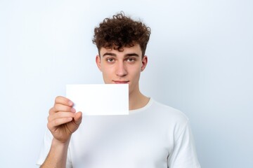 person holding an empty visit card