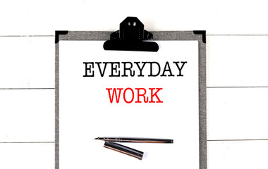 Poster - EVERYDAY WORK text on clipboard on white background