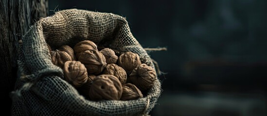 Aufkleber - Dark and moody shot featuring a sack of walnuts with space for adding text or images. Copy space image. Place for adding text and design