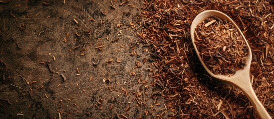 Poster - Close-up image featuring a pile of dried rooibos tea leaves and a wooden spoon, with a designated area for text known as copy space image.