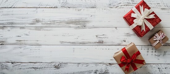 Poster - Two presents displayed on a white wooden surface with copy space image.