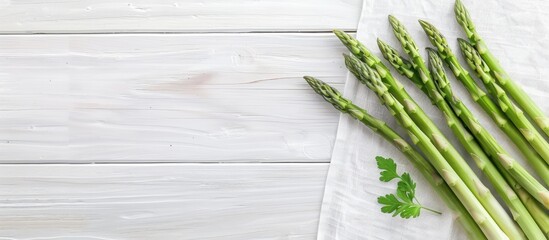 Aufkleber - Scandinavian-inspired top-down view mockup featuring fresh green asparagus on a white wooden table, designed with copy space for a blog or recipe book's visual content.