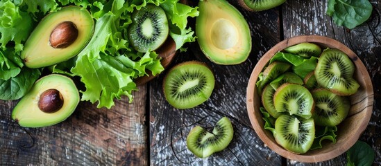 Poster - Avocado kiwi salad with lettuce mix, perfect for a healthy meal or snack, displayed on a rustic table with a top view, ideal for food backgrounds, featuring ample copy space for text.