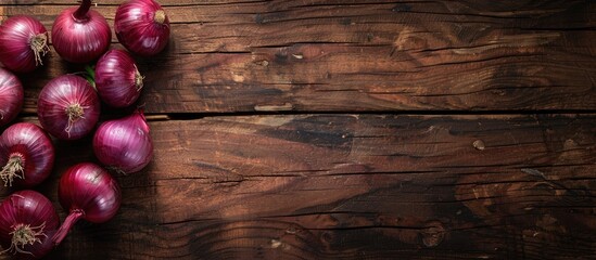 Poster - Rustic wood background with red onions creating a captivating composition for copy space image.
