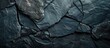 © HN Works - A dark stone backdrop with copy space image.