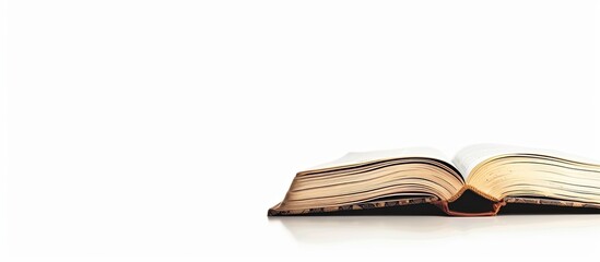 Fototapete - Copy space image with a book isolated on a white backdrop.