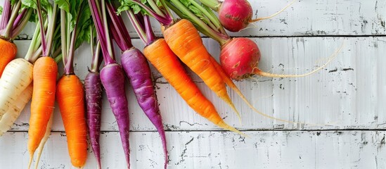 Wall Mural - Fresh carrots and turnips arranged nicely on a white wooden table, providing a perfect copy space image.