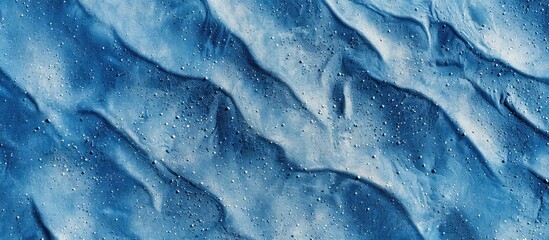 Poster - Textured blue sand background with copy space image.