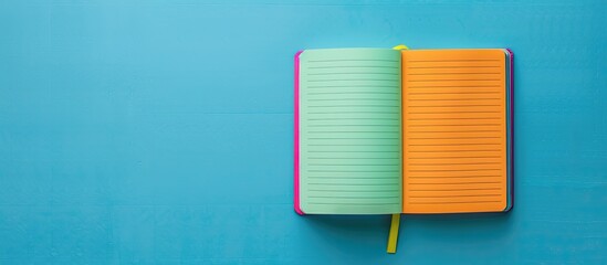 Aufkleber - Colorful blank notebook on a green-blue backdrop with room for copy space image.