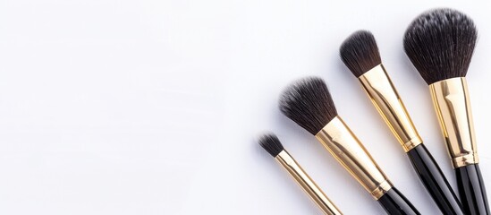 Poster - Golden makeup brushes for woman's beauty on a white background, featuring pastel colors with a copy space image.