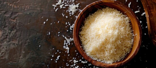 Poster - Top-down shot of grated Parmesan in a bowl with a copy space image available.