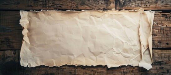 Poster - Vintage-style white paper on a wooden background with copy space image.