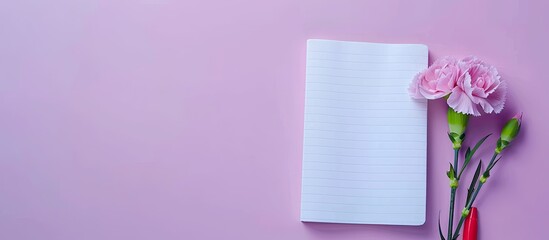 Sticker - Flat lay composition with a notebook, a carnation flower, set against a violet pastel background, providing ample space for text in the image.