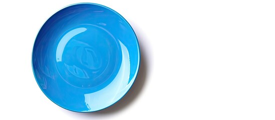 Poster - Circular blue plate positioned on a blank white backdrop with available copy space image.