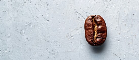 Aufkleber - Top view of a coffee bean on a white surface with available copy space image.