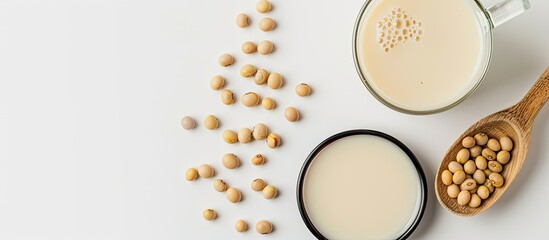 Aufkleber - Soy milk in a spoon with soybean, isolated on white background, allowing for text with copy space image.