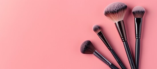 Poster - Glamorous makeup brushes displayed on a soft pink backdrop in a cosmetics store banner, showing visagist tools from a top view with a creative flat lay and copy space image.