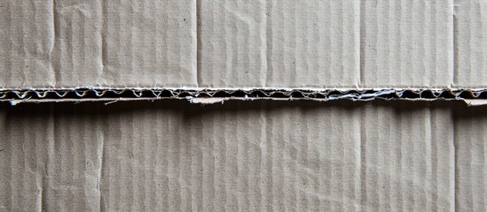 Aufkleber - A picture of corrugated grey cardboard with a white background and space to overlay text or images, or a copy space image is depicted.